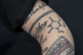 Sara showing her tattoo with the molecular composition of Chocolate